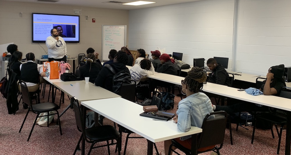 daily download presentation Detroit Scholars receiving a presentation during after-school programming at SAY Play